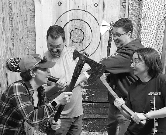 A Group of axe throwers using Bullsy app for axe throwing scoring